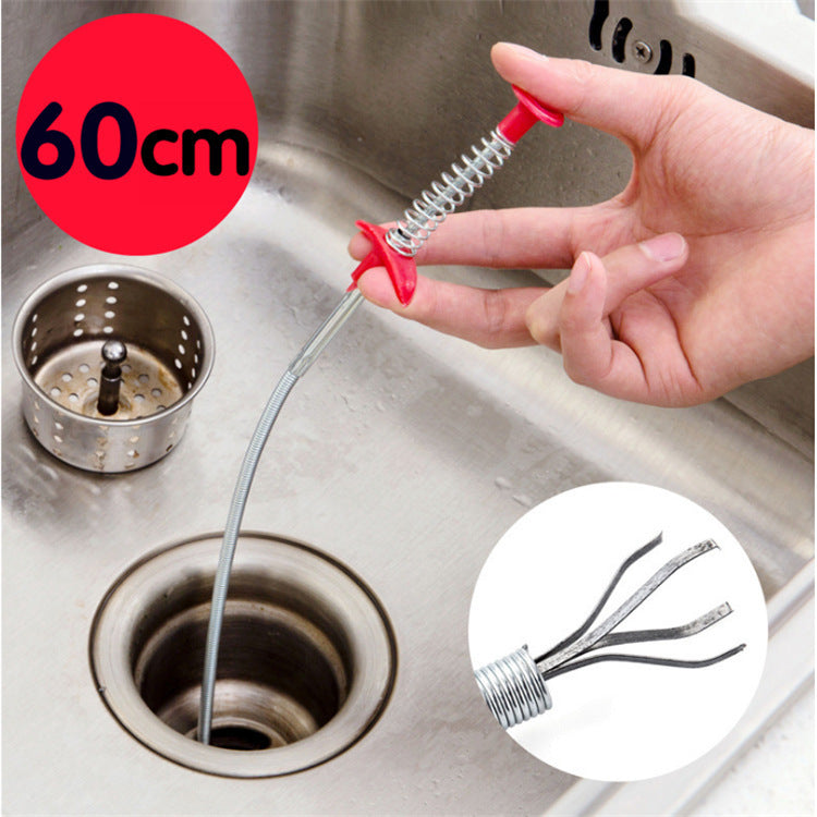 60CM flexible spring sewer dredger tool removing a hair clog from a modern kitchen sink.