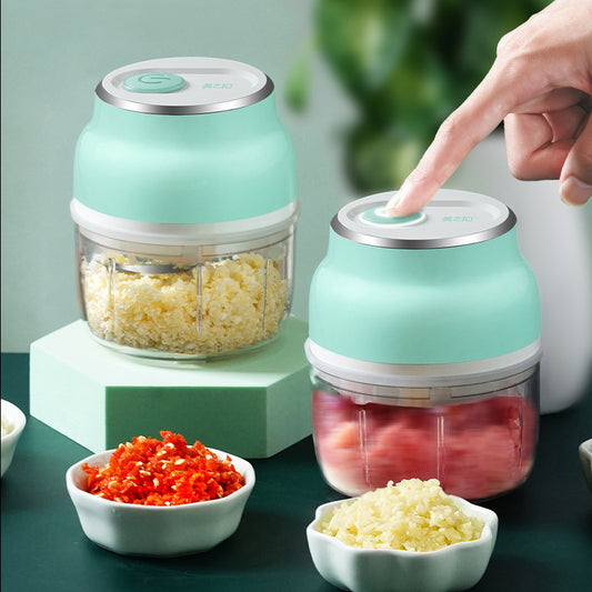 Wireless electric mini garlic chopper with stainless steel blades and USB charging port.