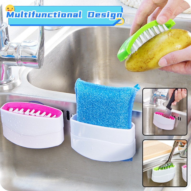 Dual-sided kitchen cleaning brush with a suction cup being used to clean a stainless steel knife.